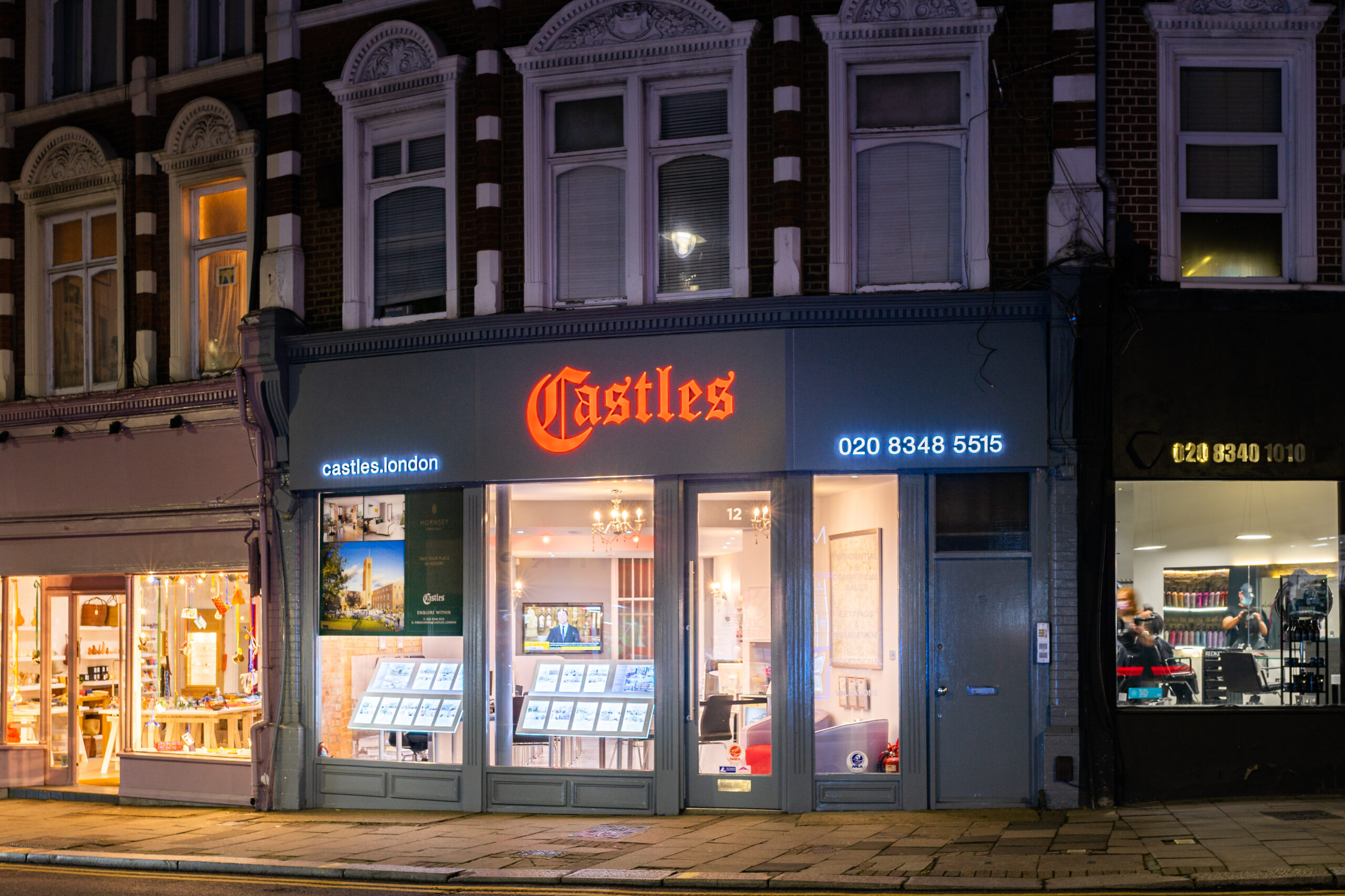 Castles Muswell Hill Estate Agents office at night.
