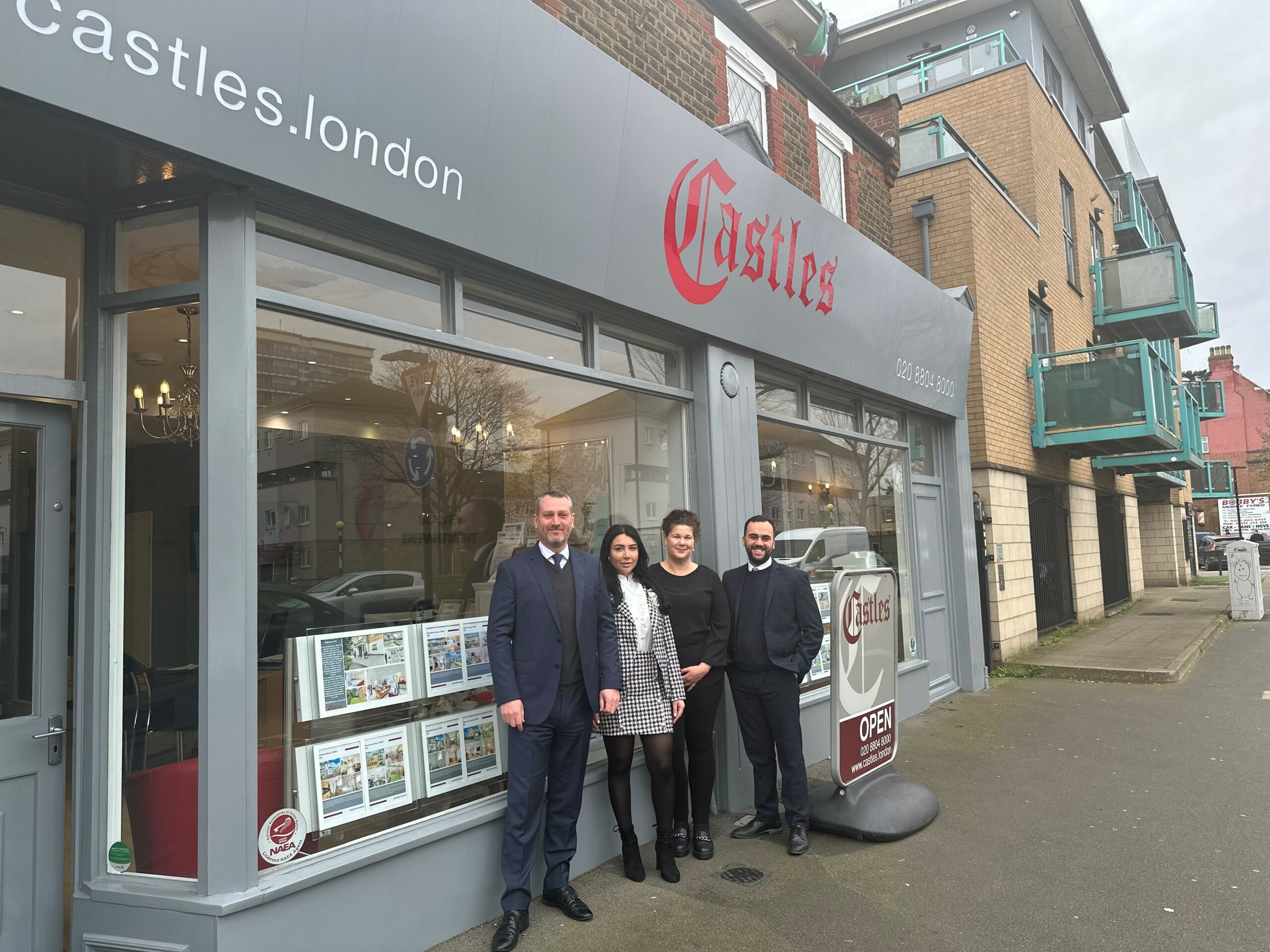 The Enfield Estate Agents team stood outside the front of the office.